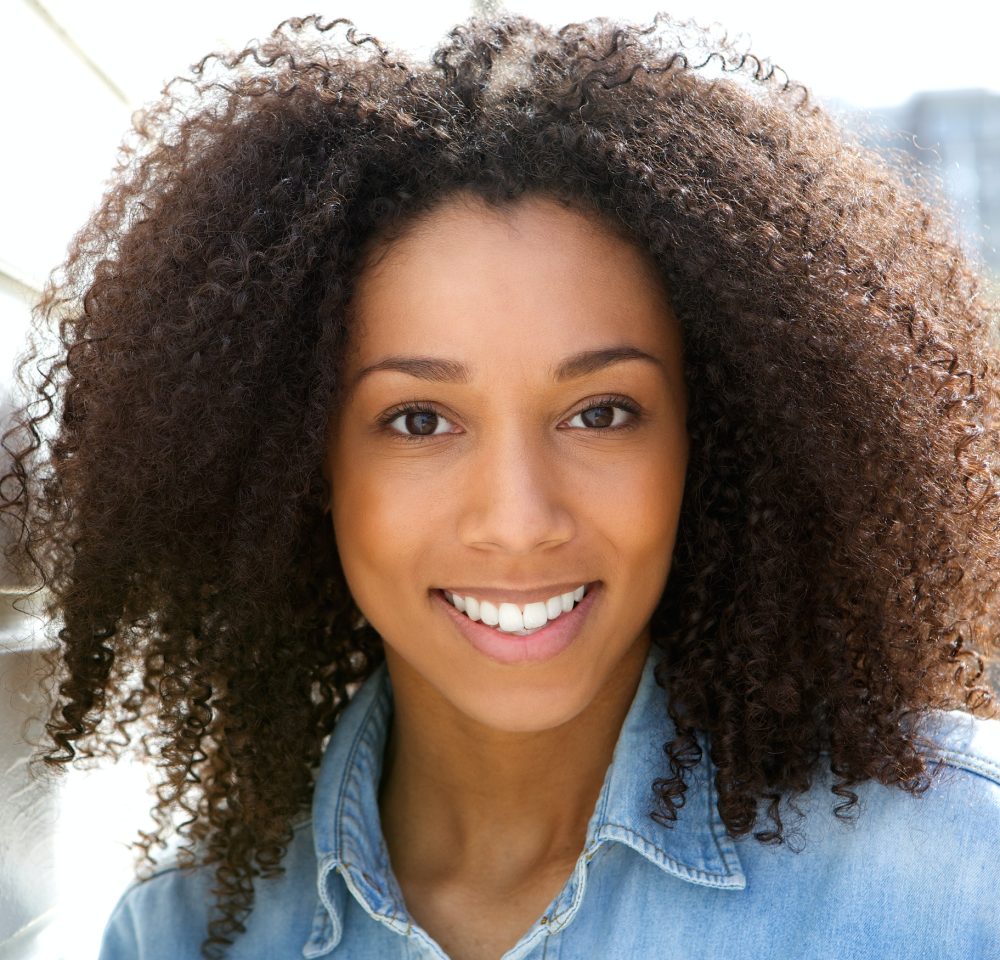 Beautiful young black woman smiling